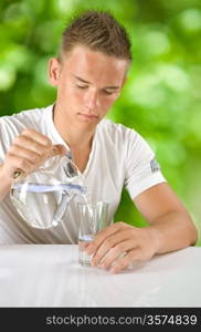 boy filling water in the glass