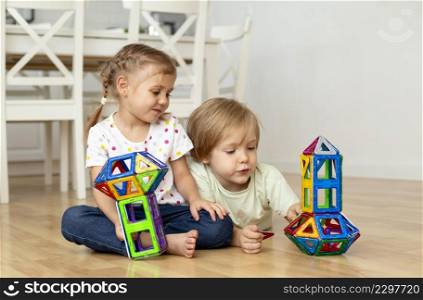boy girl home playing with toys together