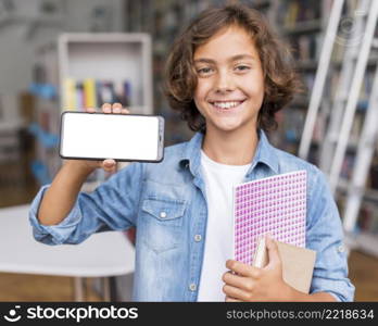 boy holding empty screen phone library