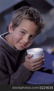 Boy holding Hot Chocolate