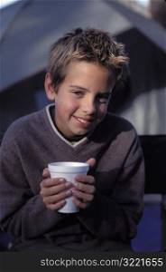 Boy holding Hot Chocolate