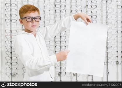boy holding pointing black white paper optics shop