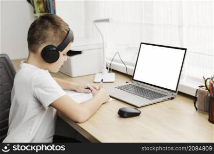 boy home attending online classes