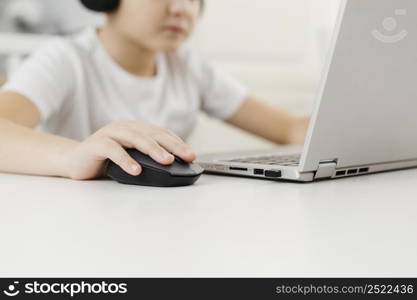 boy home playing laptop