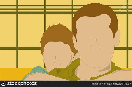 Boy hugging his father from behind