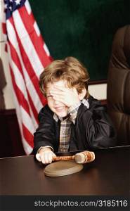 Boy imitating a judge