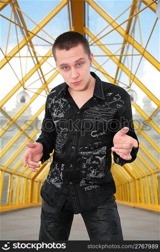 boy in black shirt on pedistrian bridge