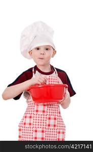boy in chef&rsquo;s hat makes the dough in a bowl isolated on white background