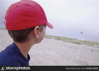 Boy in Hat at the Beach
