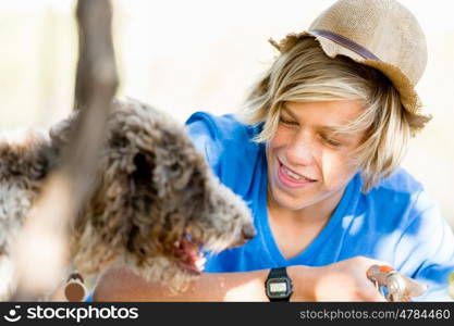 Boy in vineyard. Boy picking grapes in vineyard with a dog