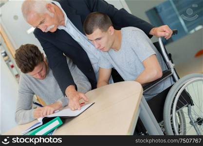 boy in wheelchair in class