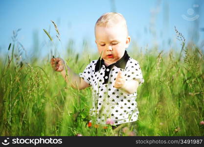 boy joy in green grass