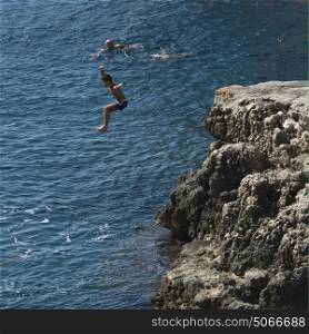 Boy jumping into the sea, Anacapri, Capri, Campania, Italy