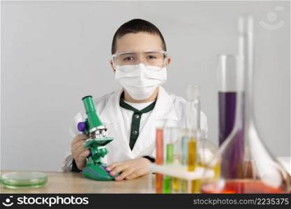 boy laboratory with microscope