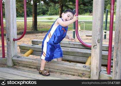 Boy Laughing And Playing At The Park.