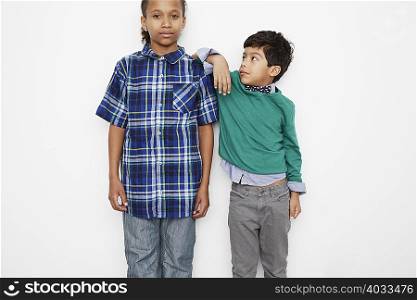 Boy leaning against friend&acute;s shoulder