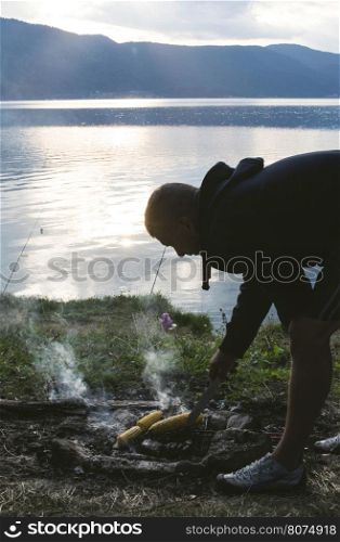 Boy making barbecue in the forest. Bulgaria
