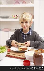 Boy Making Sandwich In Kitchen