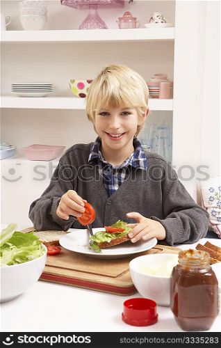 Boy Making Sandwich In Kitchen