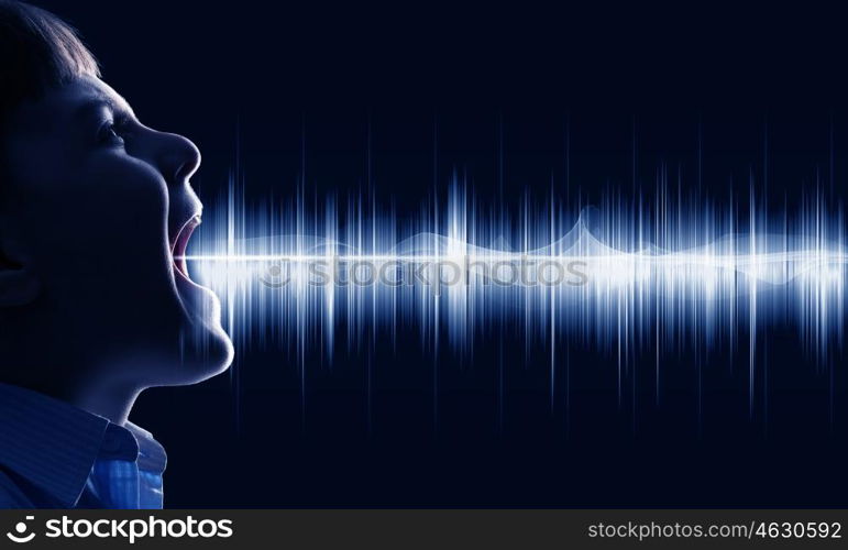 Boy making sound. Side view of boy of school age and voice coming out of his mouth