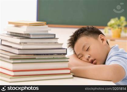 Boy napping in a classroom