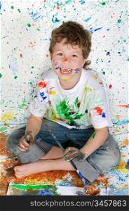 Boy no teeth playing with painting with the background painted
