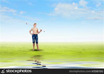 Boy of school age with fishing rod