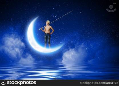 Boy of school age with fishing rod at night