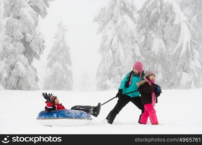 Boy on inflatable toboggan