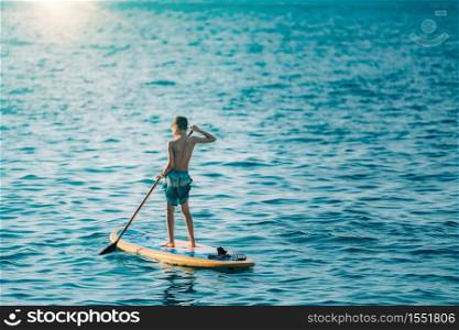 Boy on Stand Up Paddle Board or SUP