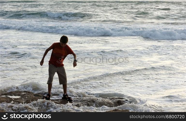 Boy on the shore of the Mediterranean Sea in Israel. Boy on the seashore