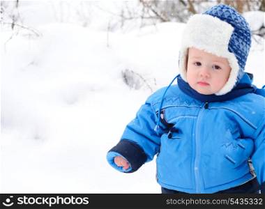 Boy outdoor are playing with snow outdoors