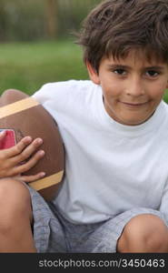 boy playing American football