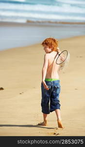 Boy Playing on Beach