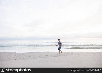 Boy playing on beach