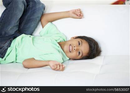 Boy Playing On Sofa