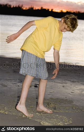 Boy playing on the beach