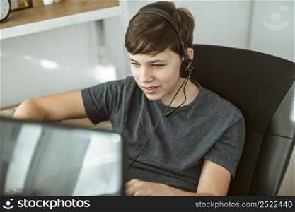 boy playing online game with his friends