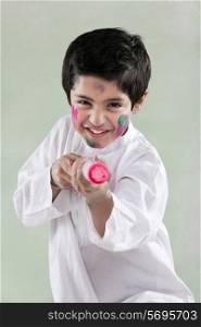 Boy playing with a pichkari