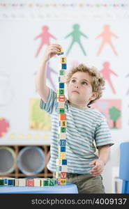 Boy playing with building blocks