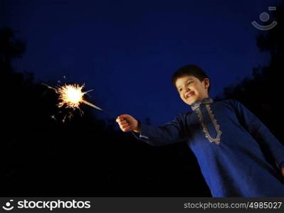 Boy playing with sparkler