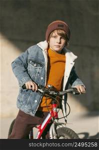 boy posing with his bike outdoors city 2