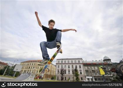 Boy practicing skate in a skate park