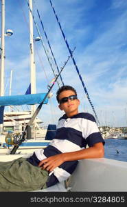 boy relaxed teenager on sea boat marina sunglasses summer vacation