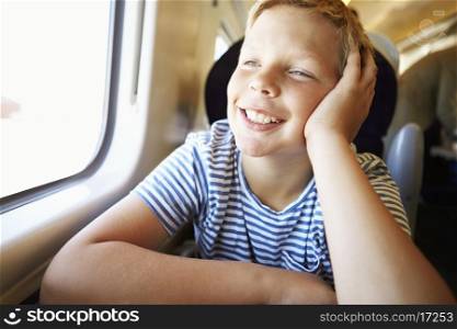 Boy Relaxing On Train Journey