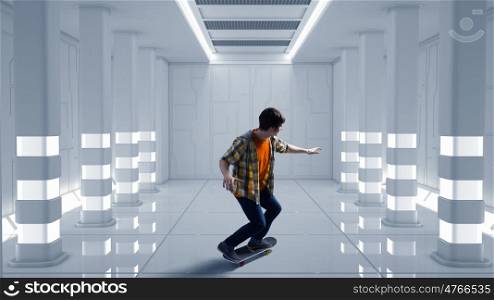 Boy ride skateboard. Active guy riding skateboard in virtual futuristic room. Mixed media . Mixed media