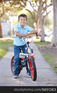Boy Riding Bike On Path