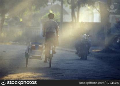 Boy Riding Bike with Sidecar