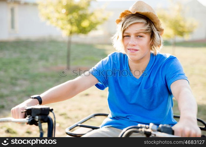 Boy riding farm truck in vineyard. Boy wearing hat and riding farm truck in vineyard