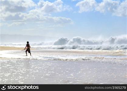 Boy Running in Surf, Hawaii